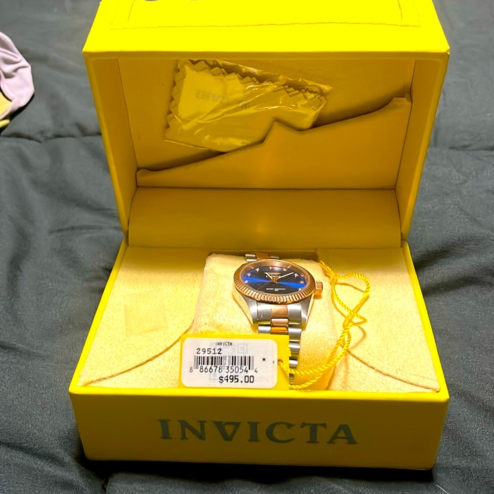 Invicta rose gold, silver and blue woman’s watch.
